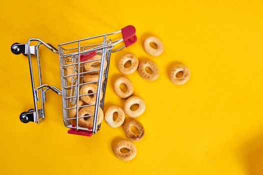 carts with groceries shopping supermarket store yellow background. High quality photo