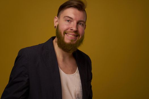 bearded man fashionable hairstyle jacket posing self confidence. High quality photo