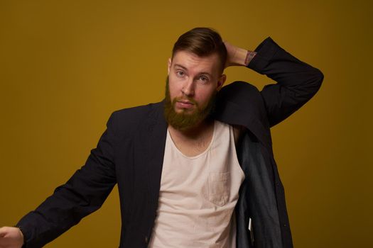 bearded man fashionable hairstyle jacket posing self confidence. High quality photo