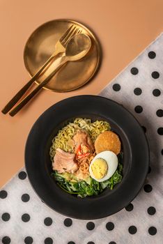 close up pork soup noodles served with boiled egg and vegetables