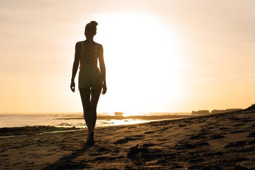 beautiful girl walking on the beach. bali