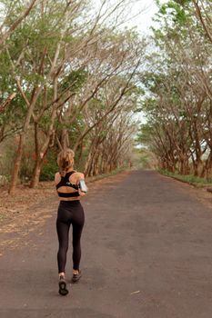 beautiful girl go in for sports. autumn. bali