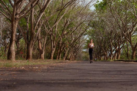 beautiful girl runs into the autumn. bali