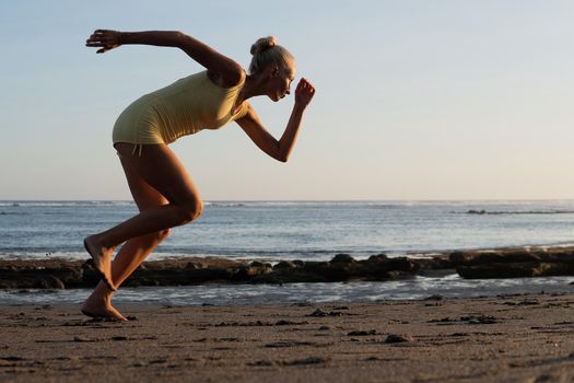 beautiful woman jogging on the beach. bali