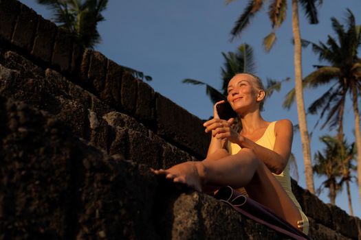 beautiful woman posing on the stones. bali