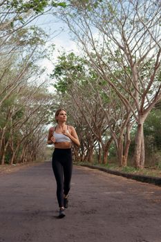 beautiful girl runs into the autumn. bali