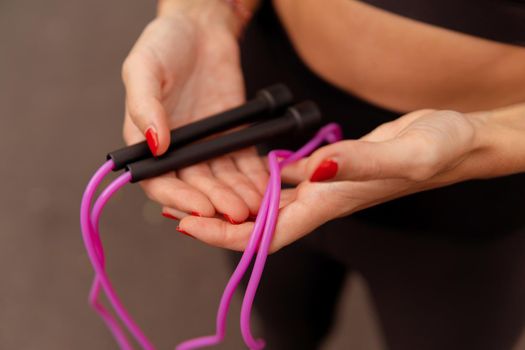 close up woman jumping pink rope. bali