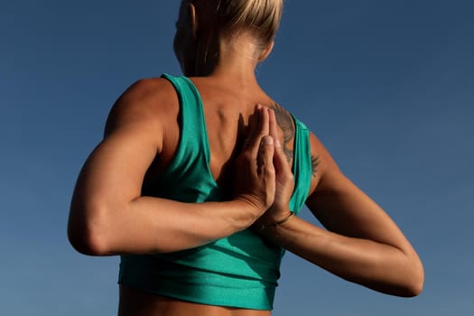 beautiful woman doing yoga. middle plan. bali