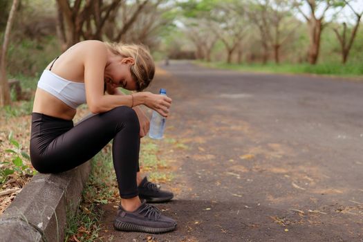 woman in sportwear tired after running. bali