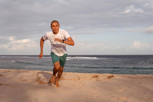 man doing sports on the beach. bali