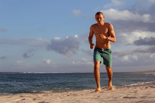 man doing sports on the beach. bali