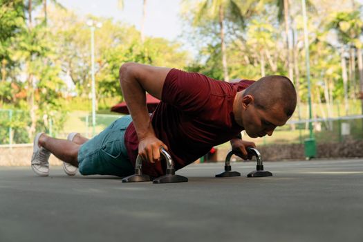 man doing push-ups on the court. bali