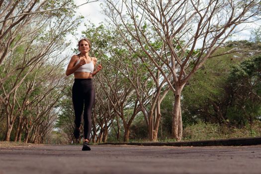 beautiful girl runs into the autumn. bali