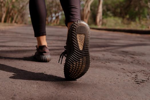 close-up of running black shoes. bali forest