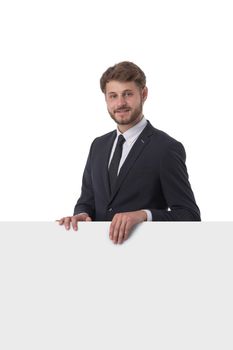 Business man displaying a banner ad isolated over a white background