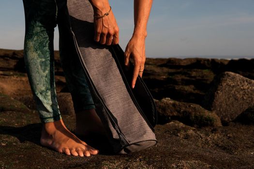 close-up. Hands reach the square for yoga