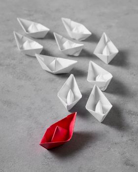 high angle boss s day arrangement with paper boats. High resolution photo