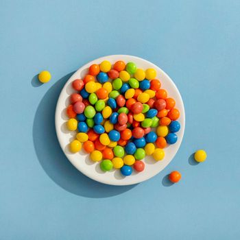 top view colorful jelly beans plate. High resolution photo