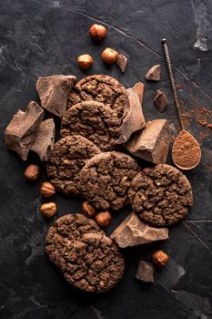 top view chocolate cookies with hazelnuts cocoa powder. High resolution photo
