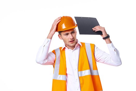 working man in orange uniform posing construction. High quality photo