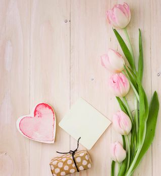 tulips with gift box paper table. High resolution photo