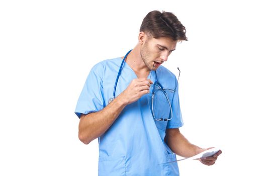 man in medical uniform x-ray diagnostics stethoscope examination work isolated background. High quality photo