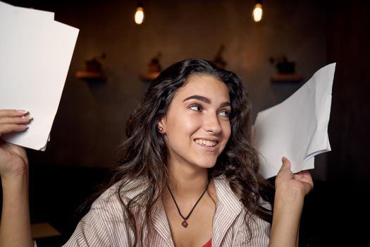 woman sitting in a cafe in front of a laptop communication technology internet. High quality photo