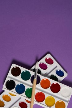 paint brushes for painting art purple background hobby. High quality photo
