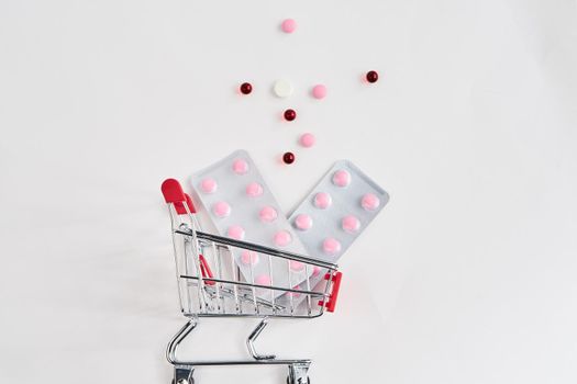 drug trolleys pharmacy shopping light background pharmacy. High quality photo