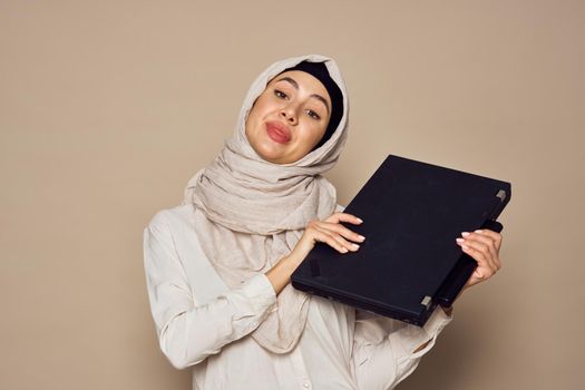 muslim woman with laptop work learning technology. High quality photo