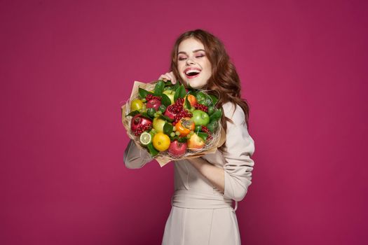 beautiful woman fun posing fruit bouquet vitamins isolated background. High quality photo