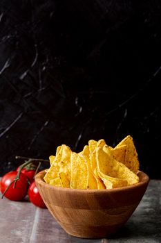 tasty nachos wooden bowl tomatoes. High resolution photo