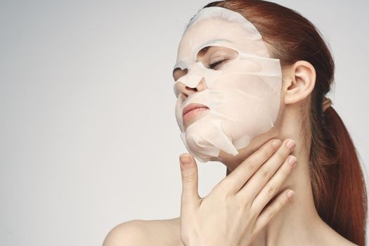 pretty woman naked shoulders face mask close-up skin care. High quality photo