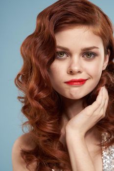 attractive red-haired woman red lips face close up. High quality photo