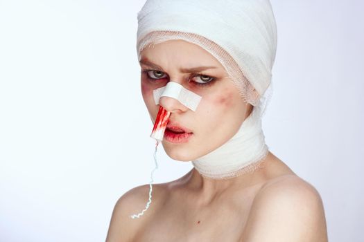 a person tampon in the nose with blood injured face studio lifestyle. High quality photo