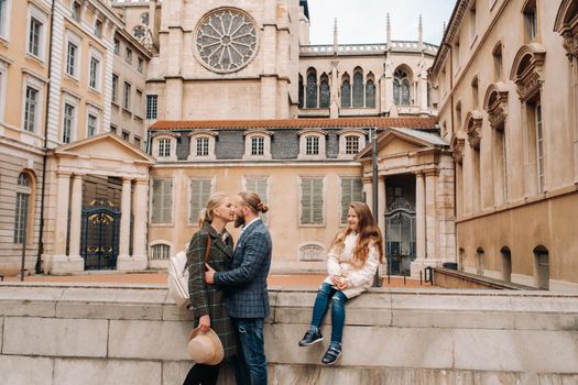 A beautiful family with strolls through the old city of Lyon in France.Family trip to the old cities of France.