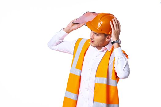 working man in orange uniform posing construction. High quality photo