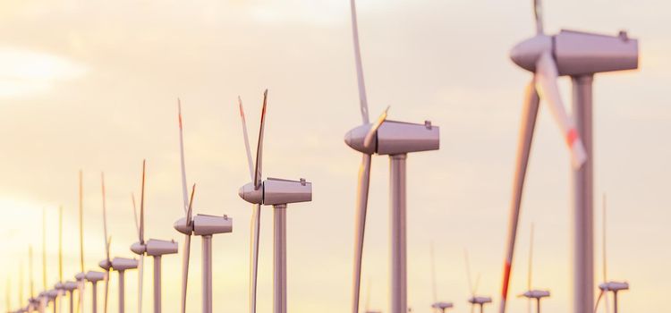 close-up of many wind turbines in a sunset with blurred background. 3d rendering