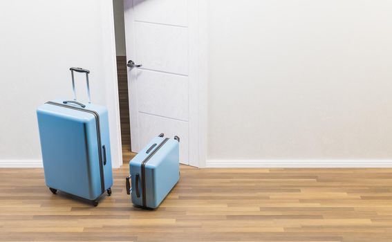 blue suitcases in front of an open door and wooden floor. travel or emancipation concept. 3d rendering
