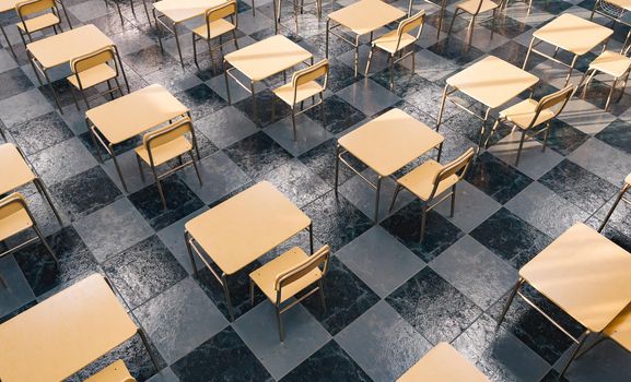 pattern of desks in an education classroom seen from above with window light illuminating. 3d rendering