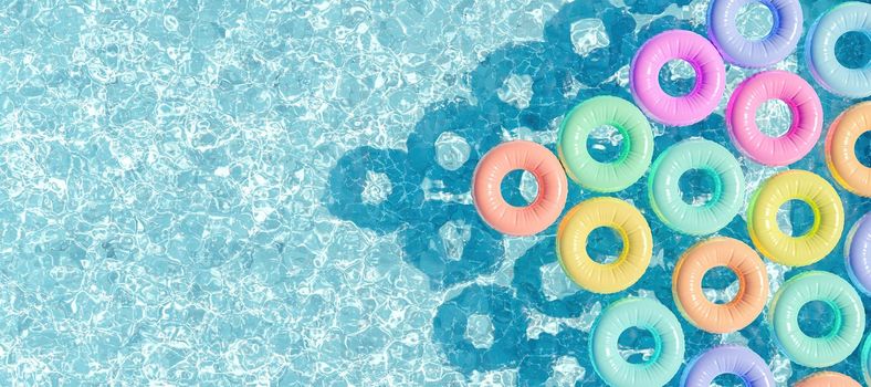 swimming pool seen from above with many rings floating in pastel colors. header. summer vacation concept. copy space. 3d render
