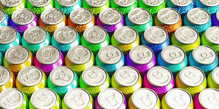 close-up of soda cans of all colors. top view. 3d render