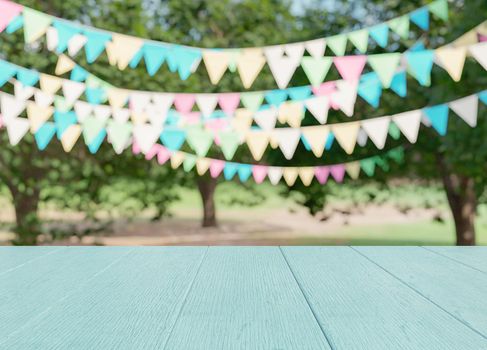 Empty wooden table with party in garden background blurred. 3d render