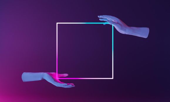 frame for presentation of design or product held by hands in an abstract scene with neon lighting. 3d render