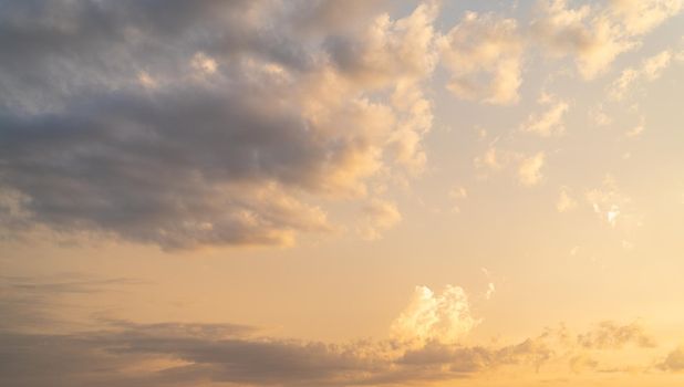 sky background with dramatic sunset and warm clouds