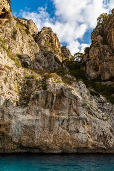 Edge of high cliff next to the sea at sunny day on Capri island