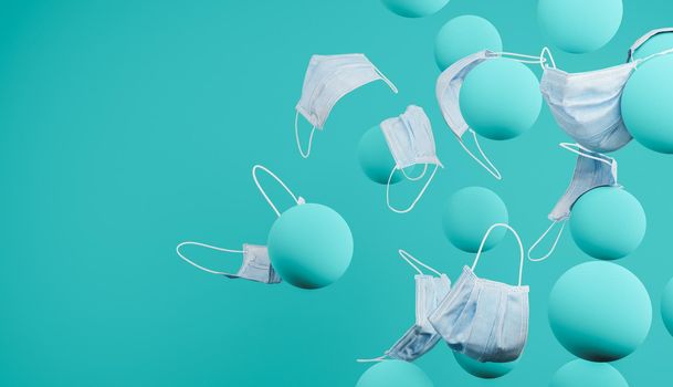 surgical masks falling on blue spheres. abstract and minimalist scene. health concept. 3d render