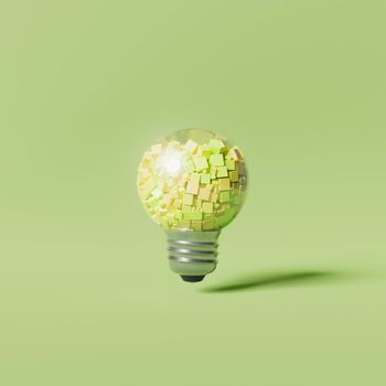 minimal light bulb filled with pastel colored cubes suspended on green background. 3d render