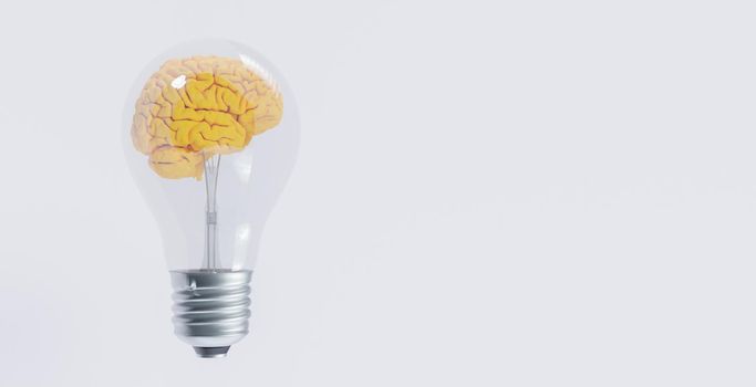incandescent light bulb with yellow brain inside it on white background. idea concept. 3d render. copyspace