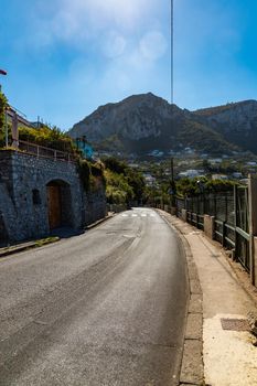 Street view to buildings and mountains on Capri island at sunny day